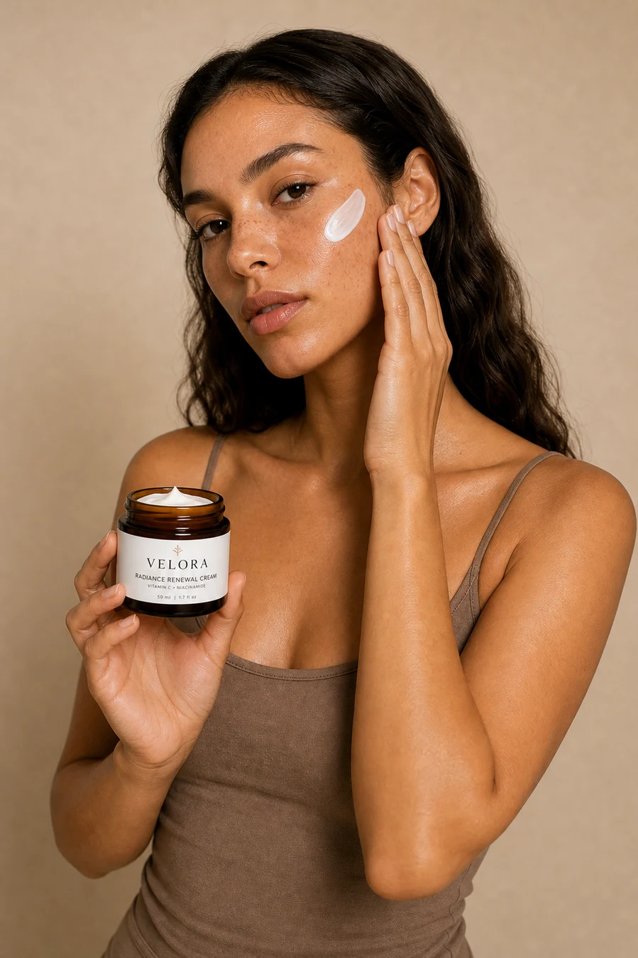 Half-body skincare portrait holding a Velora jar